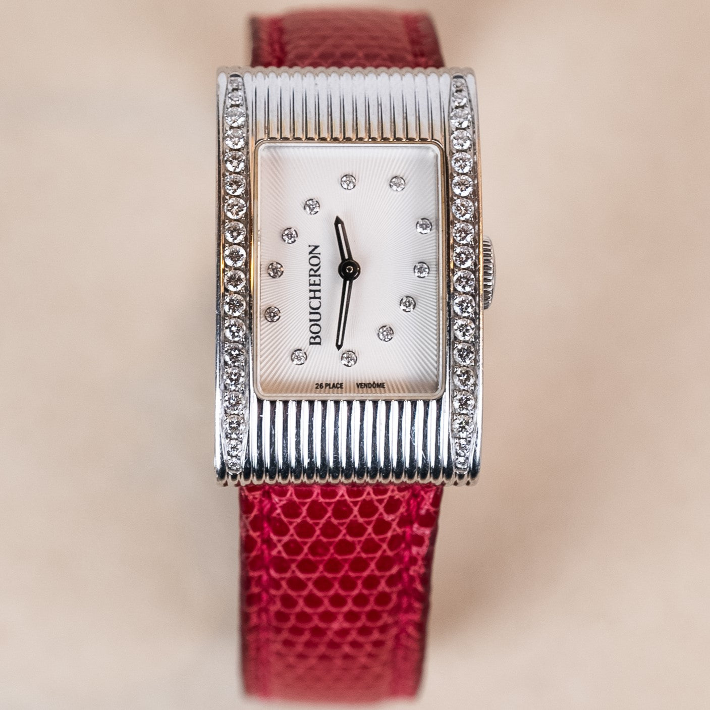 Boucheron Reflet Lady watch in 34 X 21 mm steel case with a diamonds-paved bezel powered by a quartz movement on an interchangeable leather strap face view