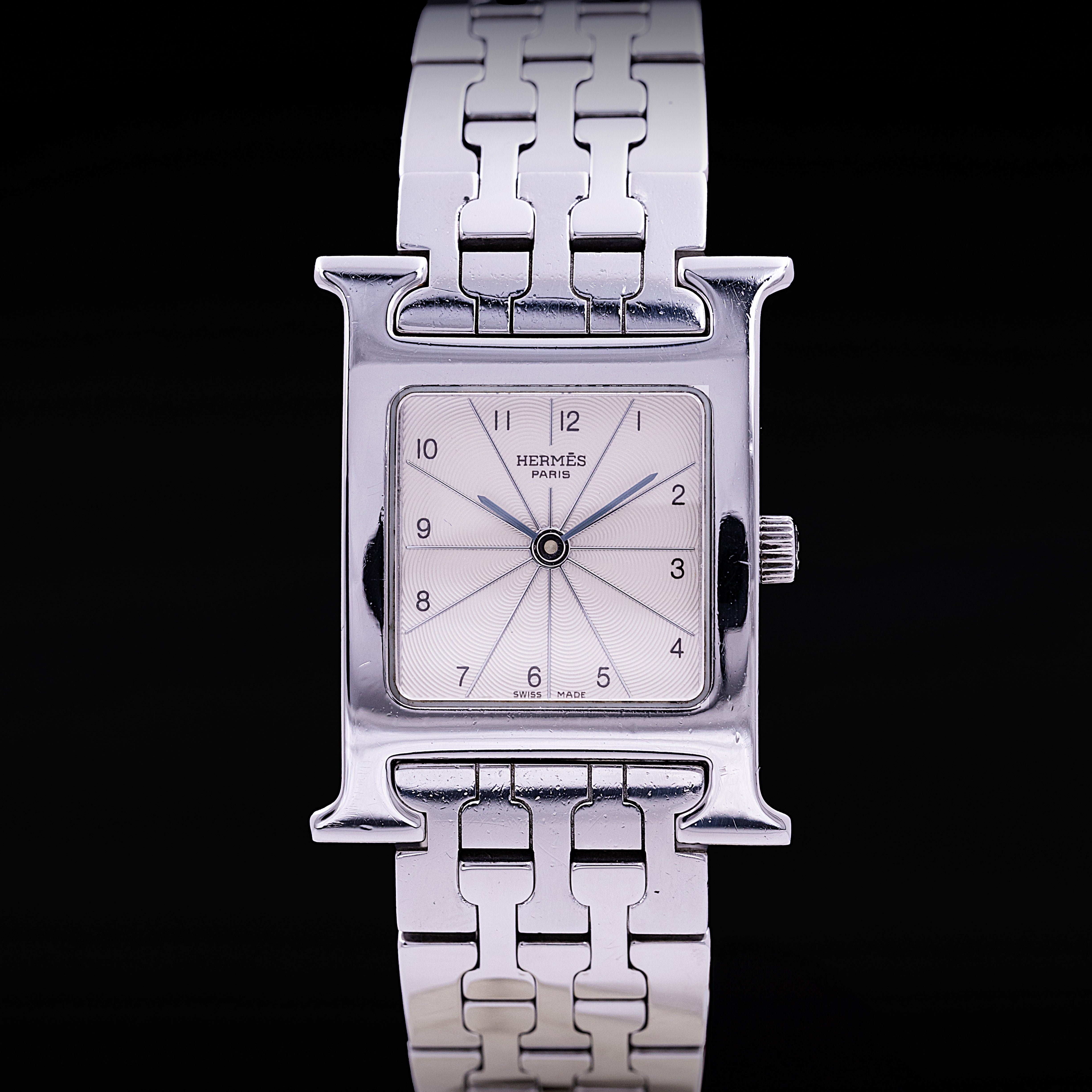 Montre Hermès Heure H acier taille femme cadran silver guilloché chiffres arabes années 2010