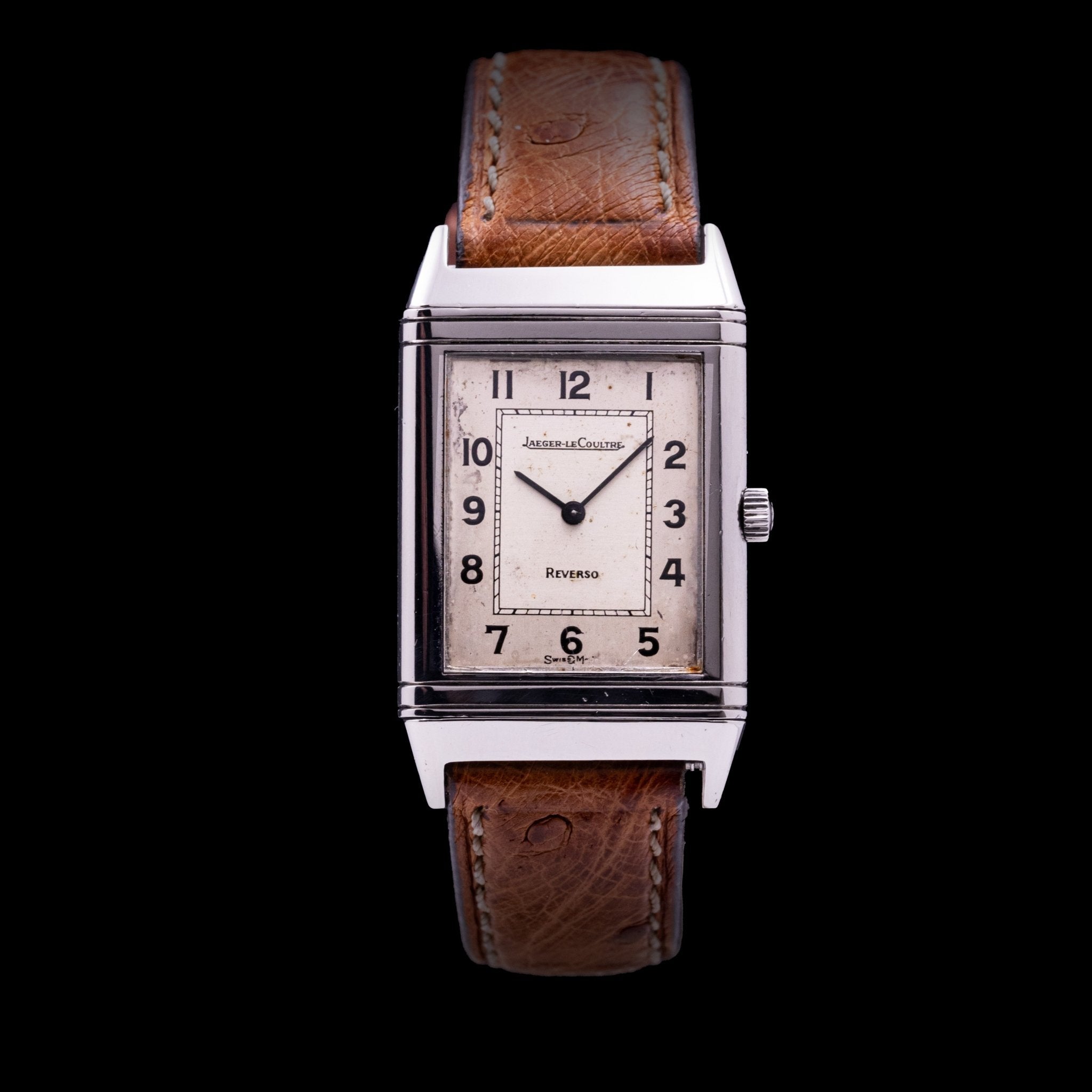 Jaeger-LeCoultre Reverso Classique Monoface Acier référence 140.021.8, mouvement quartz, boîtier acier pivotant 23 x 32 mm, cadran silver à deux tons patiné, chiffres arabes noirs, bracelet cuir et boucle ardillon monogrammée, années 1980