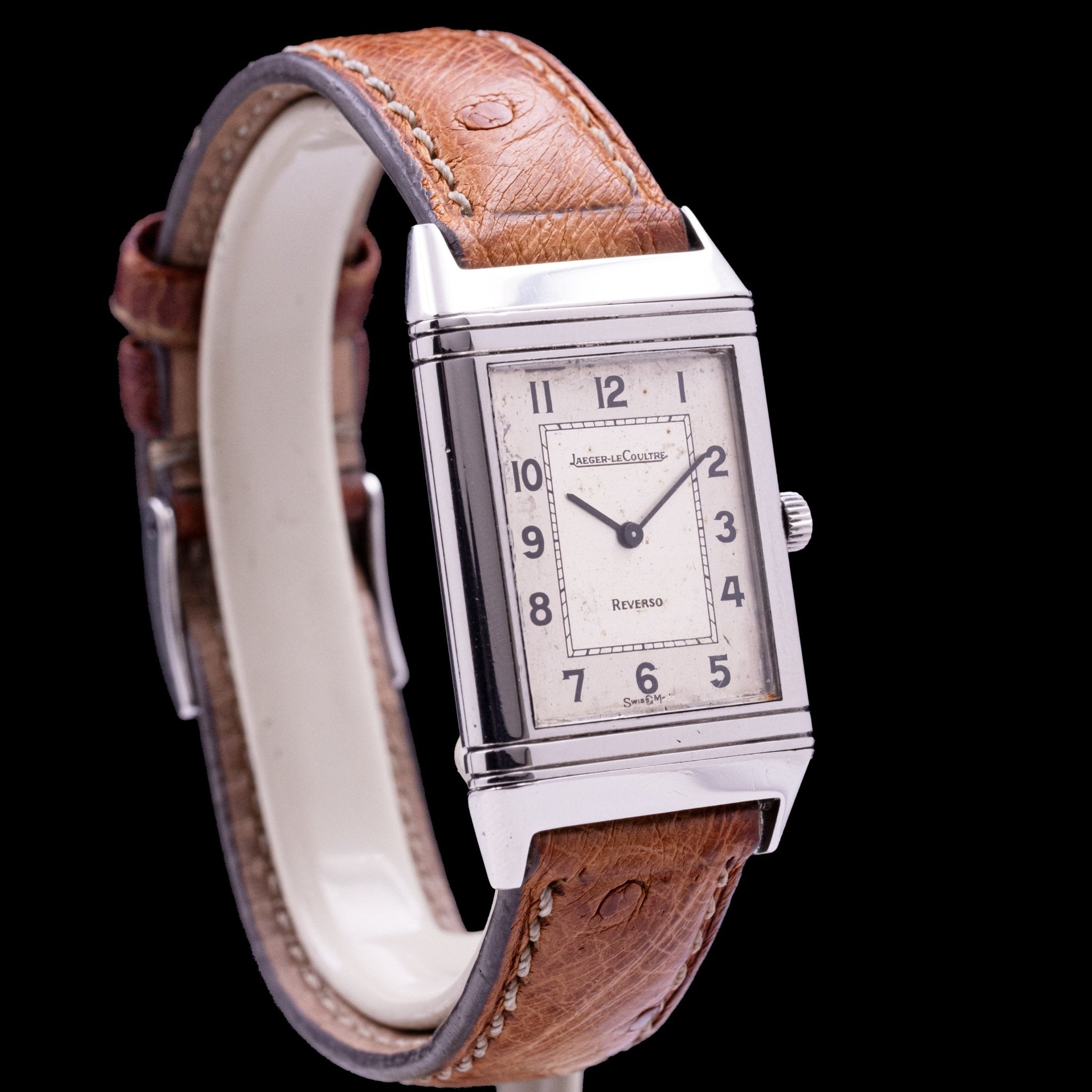 Jaeger-LeCoultre Reverso Classique Monoface Steel reference 140.021.8, quartz movement, reversible steel case 23 x 32 mm, two-tone silver dial with patina, black Arabic numerals, leather strap with monogrammed pin buckle, 1980s