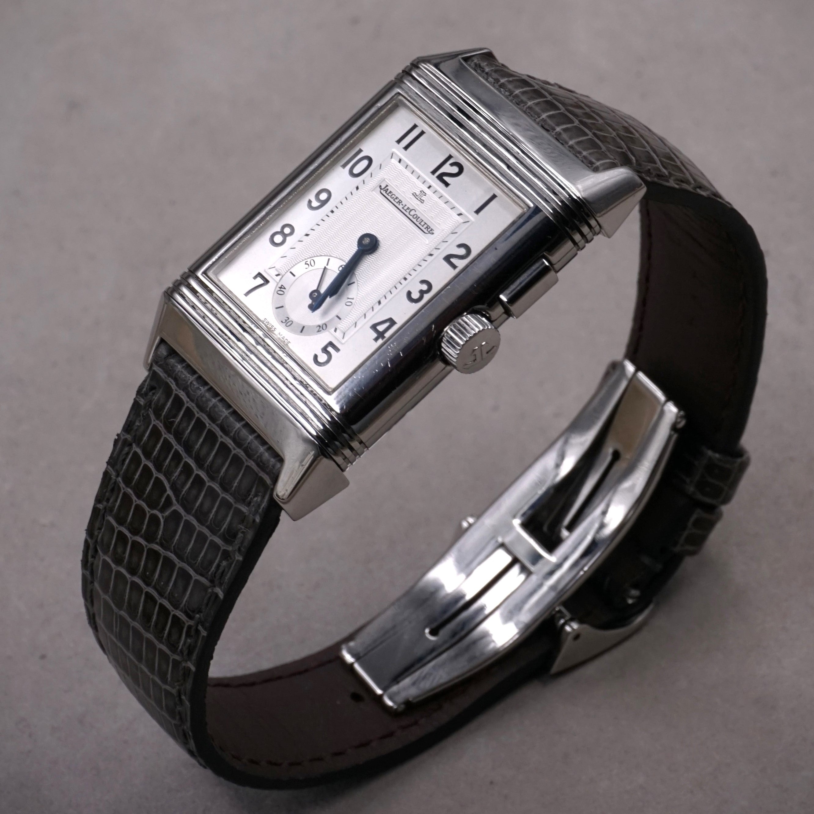 Jaeger-Lecoultre Reverso Night & Day vintage watch in steel with 2 time zones and hand wound movement on leather strap with original folding clasp silver 3/4 view