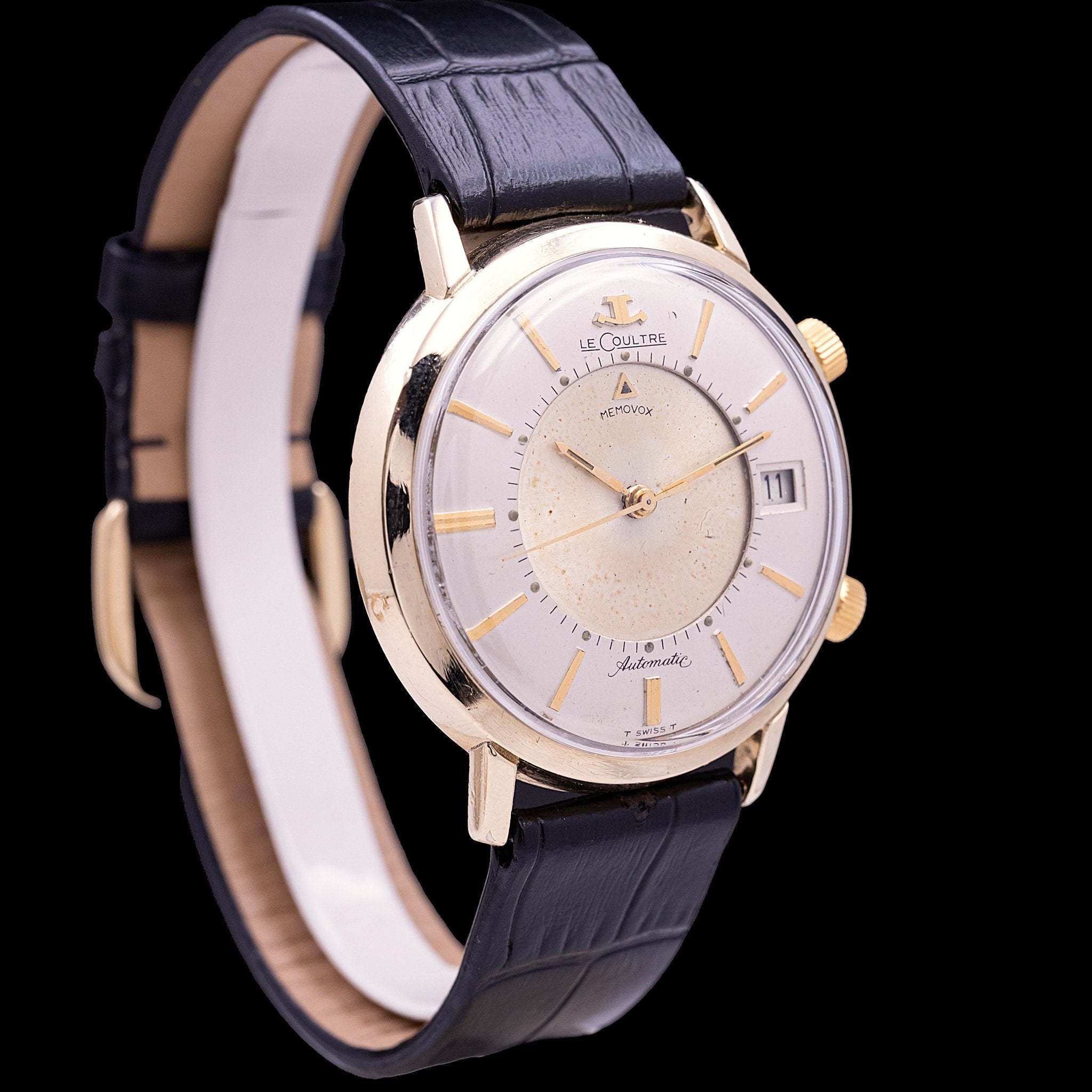 LeCoultre Memovox Automatic Gold Filled, automatic movement for the time and manual for the alarm, 38 mm Gold Filled case, twin crowns, patinated silver dial with gold baton indexes, gold lance hands, red alarm-pointer triangle, date aperture at 3 o'clock, American market, ca. 1965