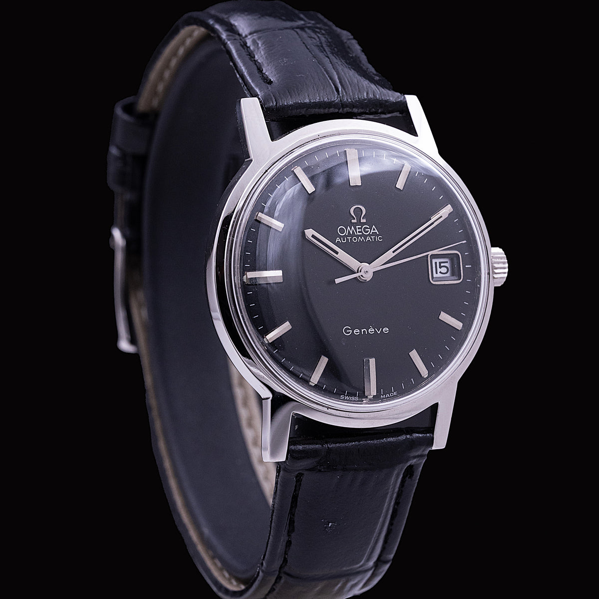 Omega Genève classic automatic in steel, calibre 563 with date, black dial with applied baton indexes, leather strap
