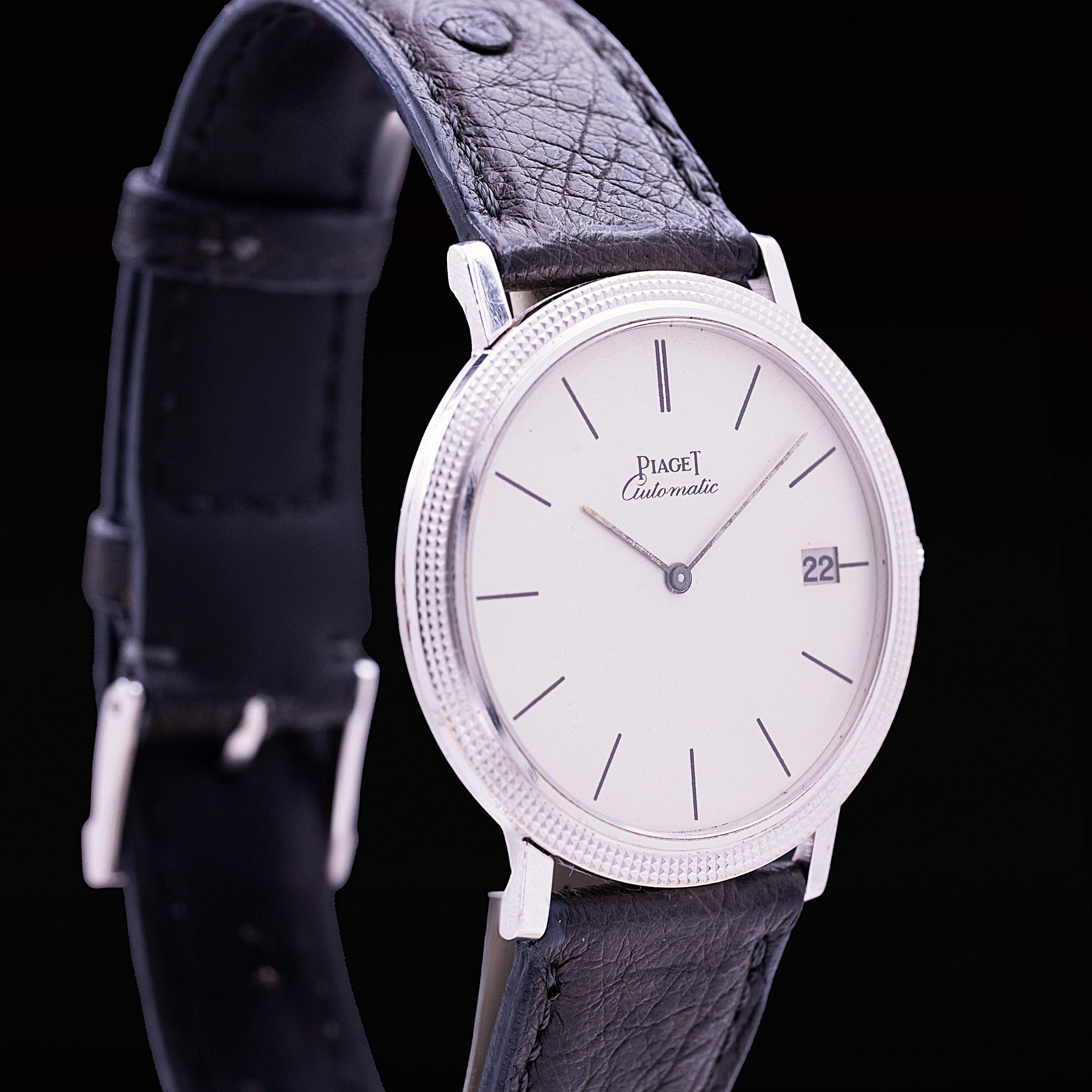 Piaget Automatic extra-thin 18-carat white gold clous de Paris bezel white dial watch Ref. 13104