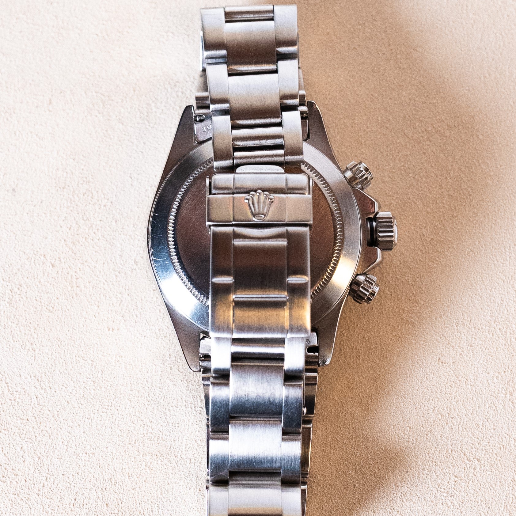 Rolex Cosmograph Daytona vintage chronograph reference 16520, in steel from the W series (1995) with black dial and sub-counters developing the so-called "Patrizzi" patina, on a steel Oyster bracelet equipped with the exceptional self-winding Zenith El Primero movement folding clasp view