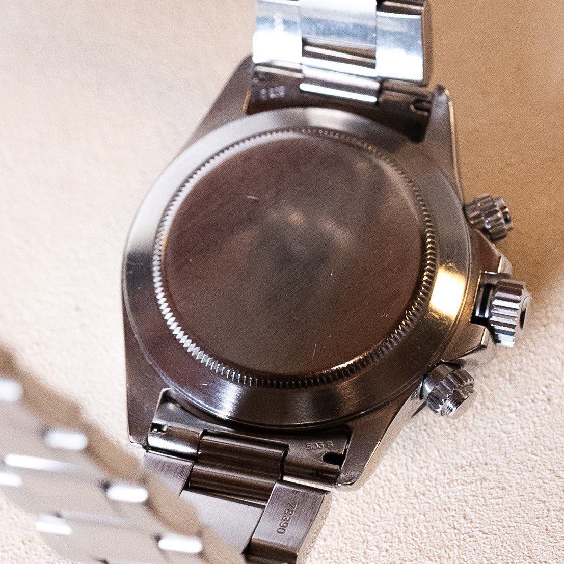 Rolex Cosmograph Daytona vintage chronograph reference 16520, in steel from the W series (1995) with black dial and sub-counters developing the so-called "Patrizzi" patina, on a steel Oyster bracelet equipped with the exceptional self-winding Zenith El Primero movement case back view