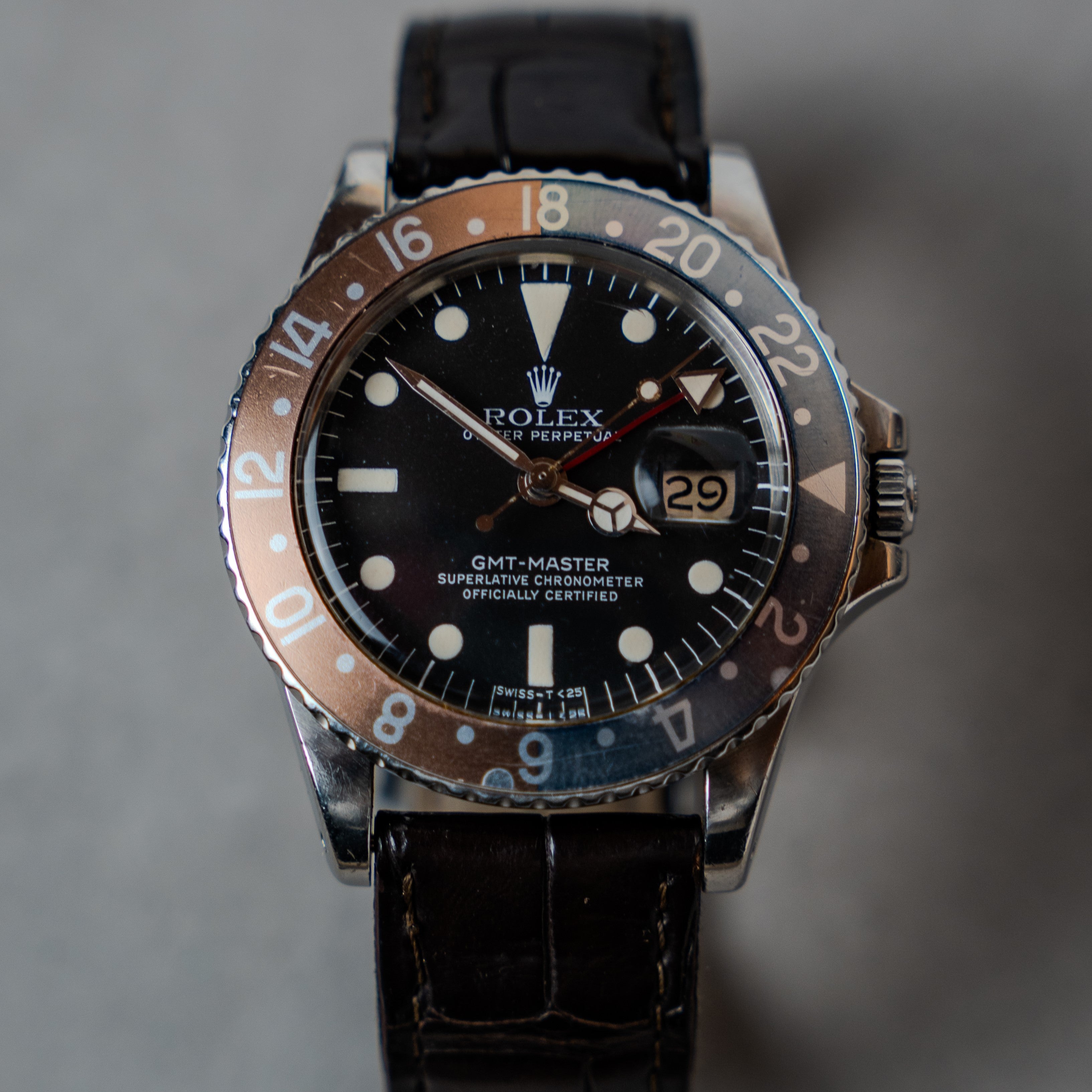 Rolex GMT Master "Pepsi" ref 1675 with rare intense patina red and blue bezel on leather strap from 1967 face view