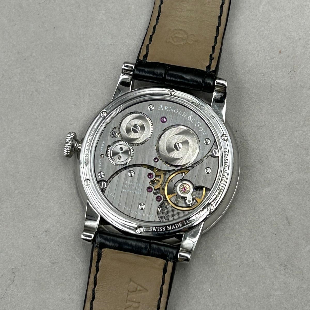 Arnold & Son HMS1  vintage watch in 40 mm steel case from 2001 with manual winding case back view