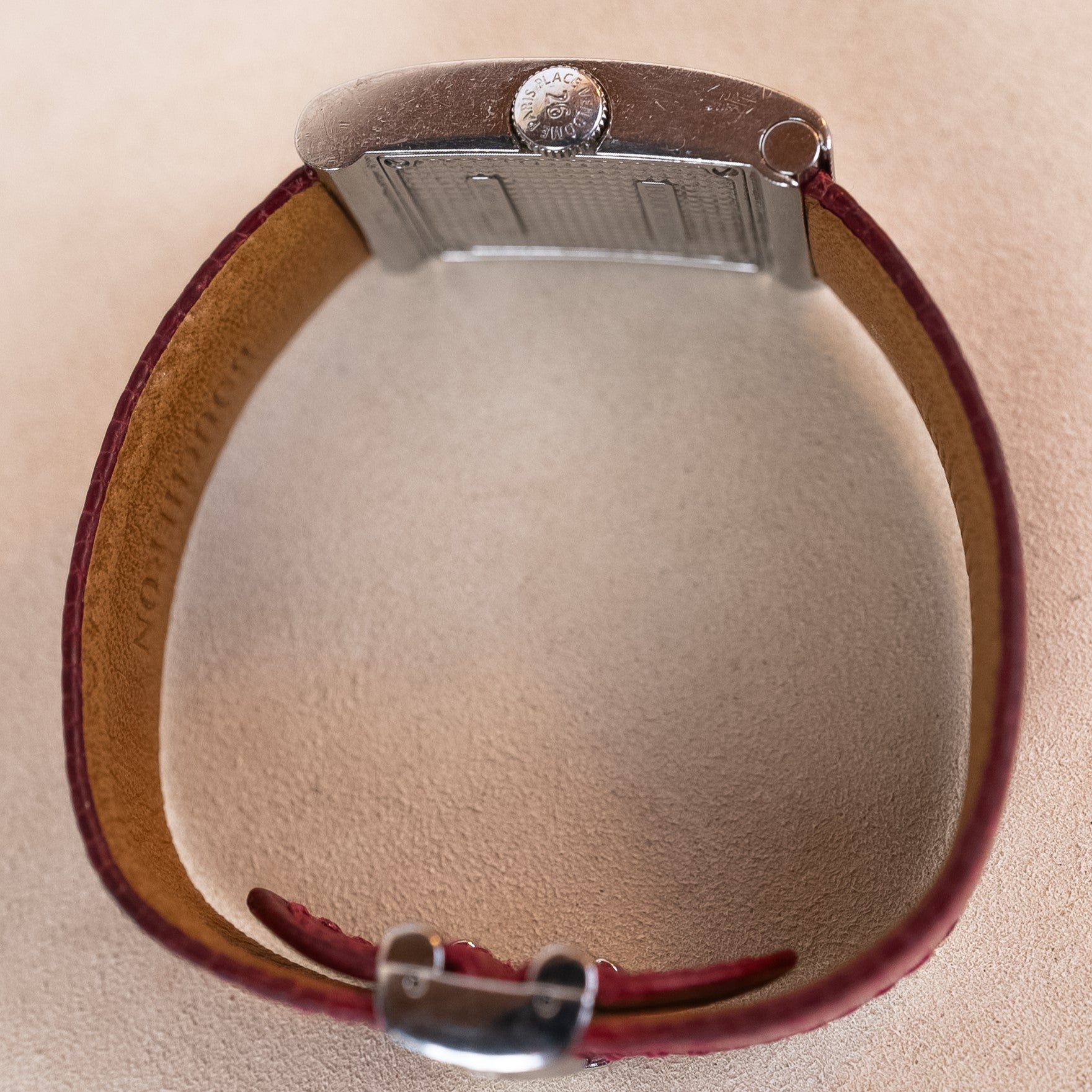 Boucheron Reflet Lady watch in 34 X 21 mm steel case with a diamonds-paved bezel powered by a quartz movement on an interchangeable leather strap crown profile view