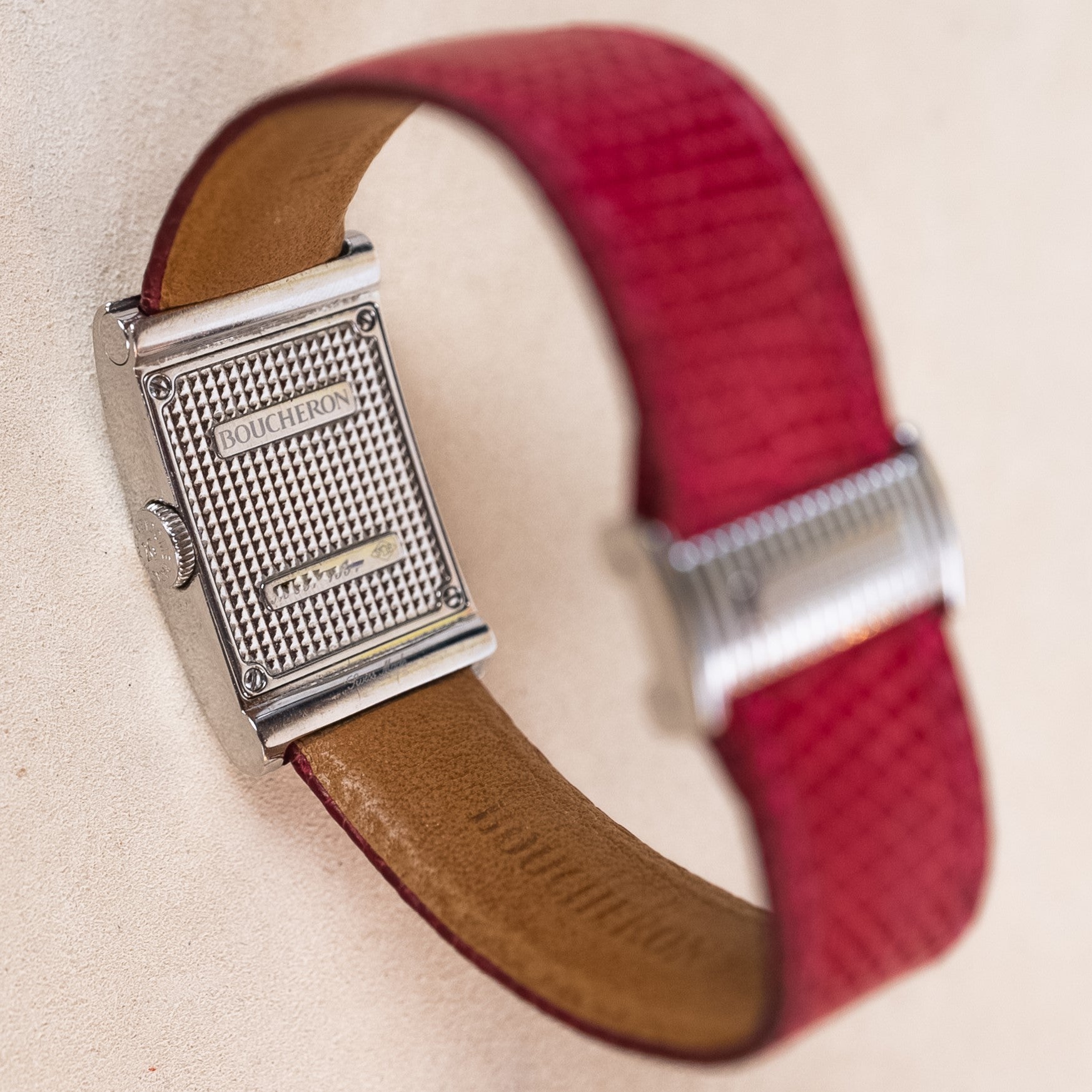 Boucheron Reflet Lady watch in 34 X 21 mm steel case with a diamonds-paved bezel powered by a quartz movement on an interchangeable leather strap case back view