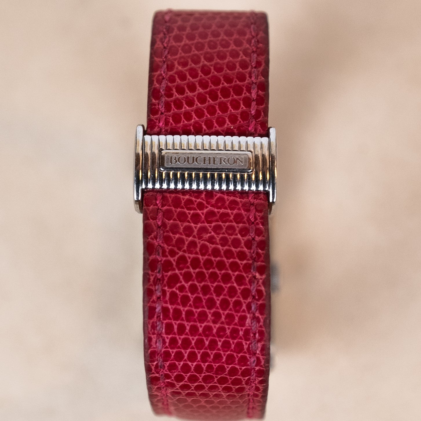 Boucheron Reflet Lady watch in 34 X 21 mm steel case with a diamonds-paved bezel powered by a quartz movement on an interchangeable leather strap buckle view