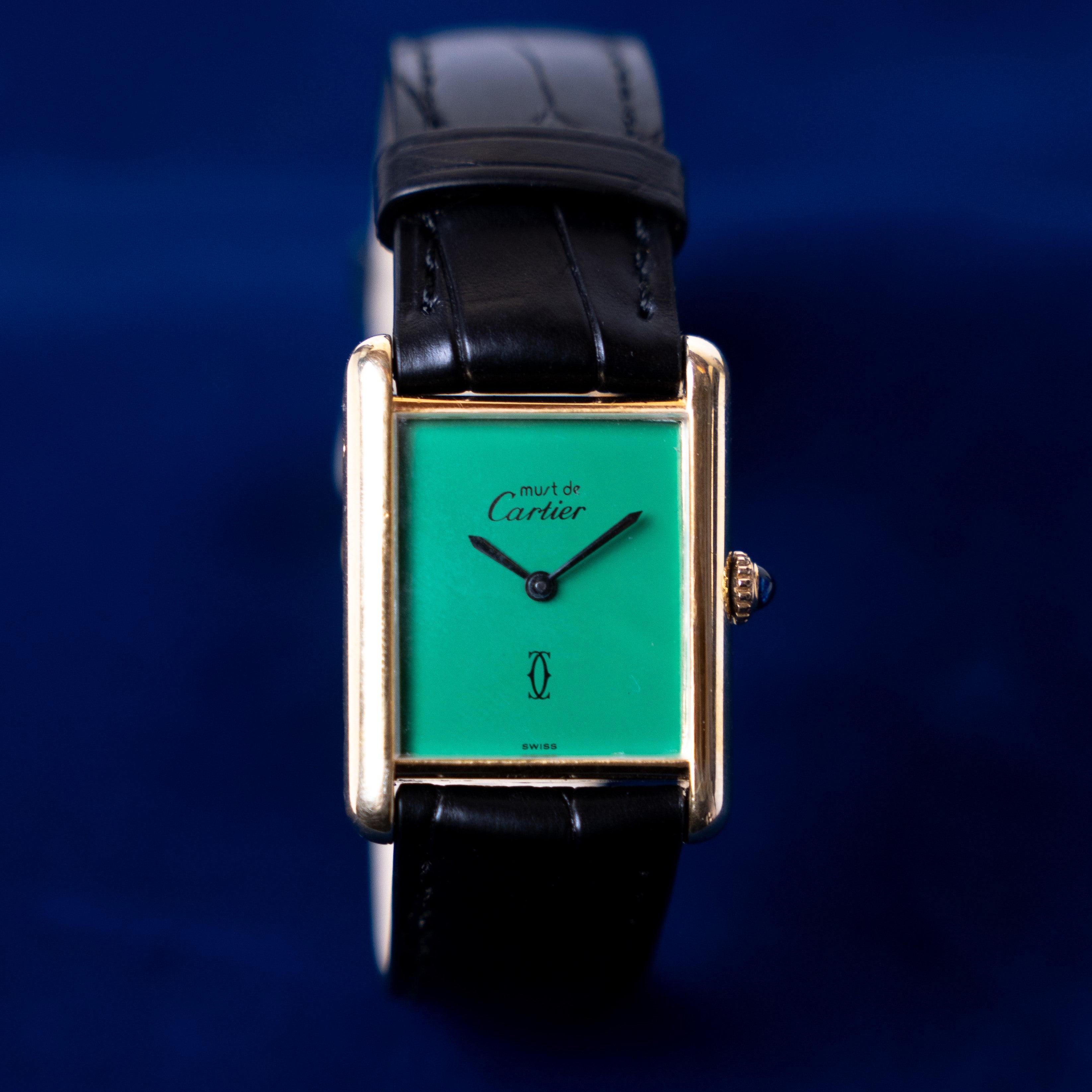 Tank Must de Cartier manual winding vintage watch in Vermeil (gold plated solid silver) with fully restored green dial on leather strap with gold plated pin buckle face view