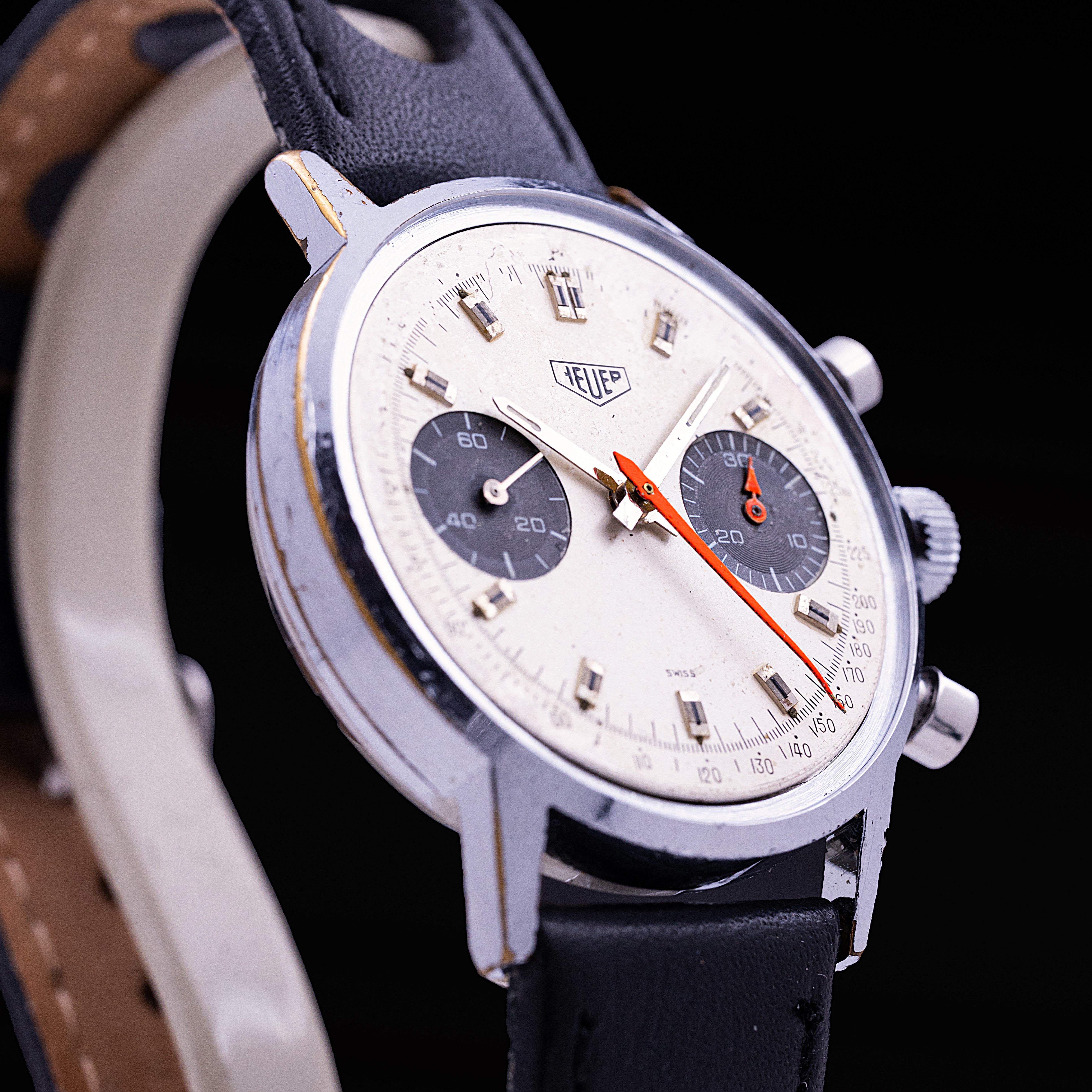 Heuer two-register chronograph, chrome-plated case, silvered dial with black registers and orange chronograph hands