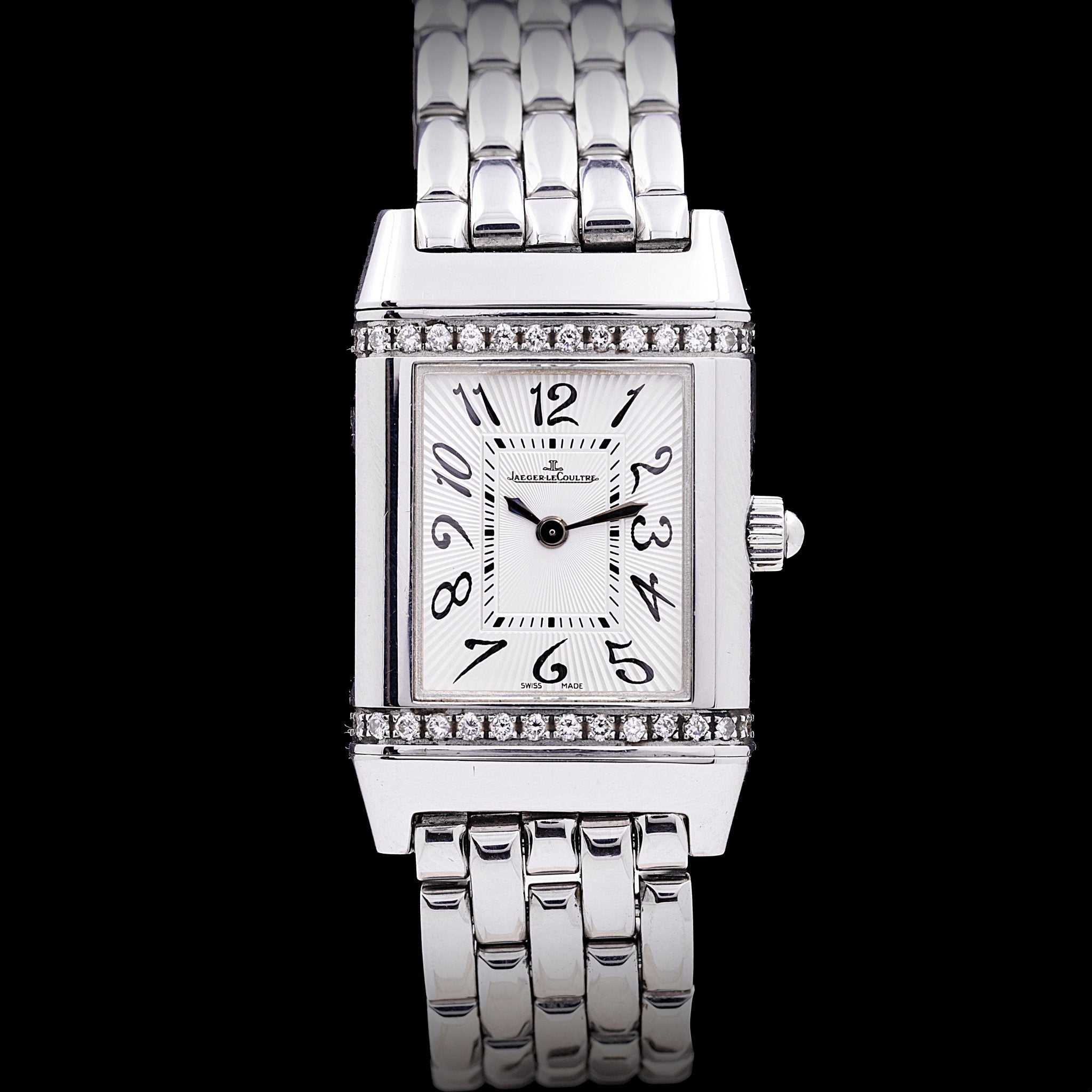Jaeger-LeCoultre Reverso Lady Acier et Diamants référence 265.8.08, mouvement quartz, boîtier acier pivotant 21 x 33 mm, brancards supérieur et inférieur sertis de diamants, cadran silver guilloché soleil, chiffres arabes stylisés, bracelet acier grains de riz d'origine, années 2000