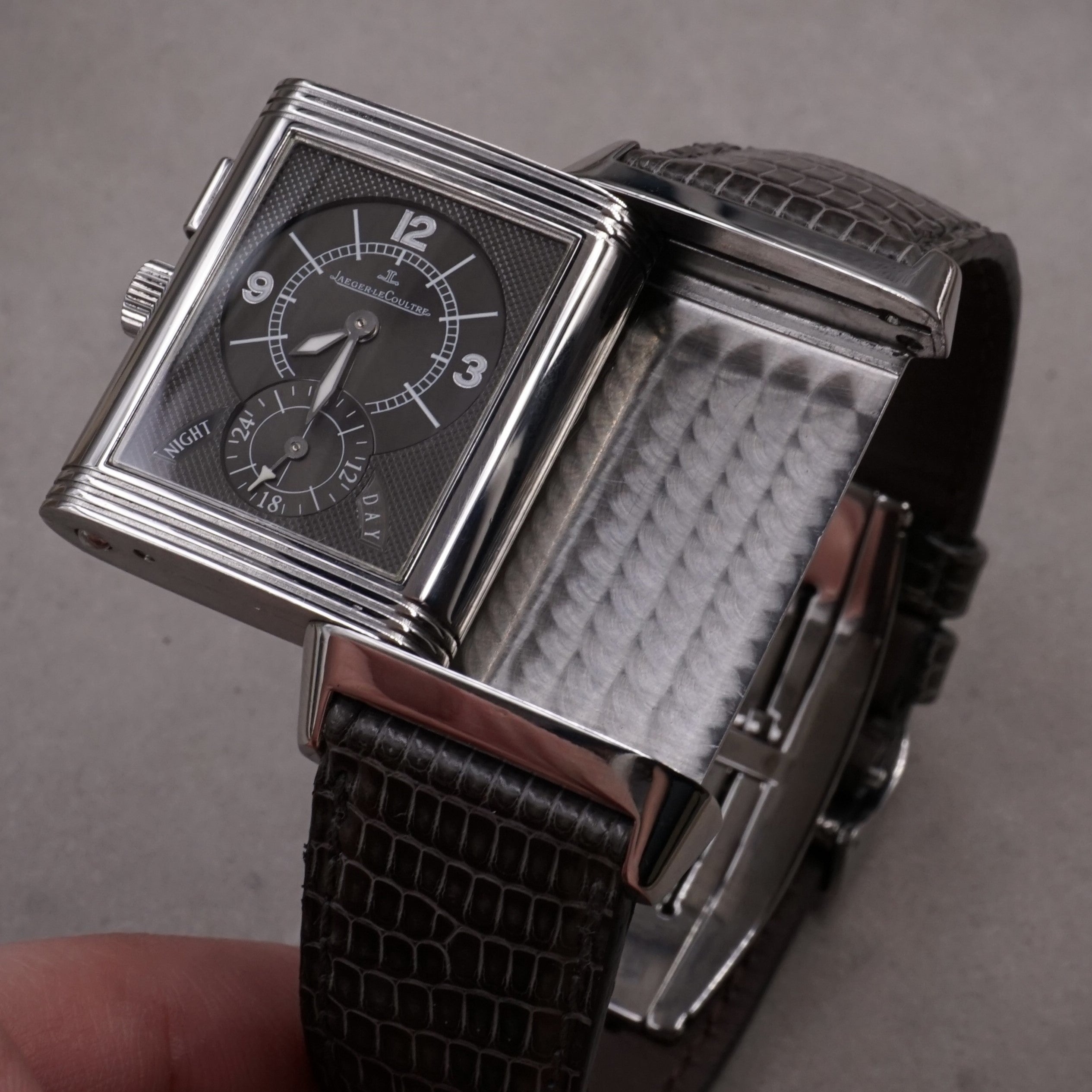 Jaeger-Lecoultre Reverso Night & Day vintage watch in steel with 2 time zones  and hand wound movement on leather strap with original folding clasp night face open view 