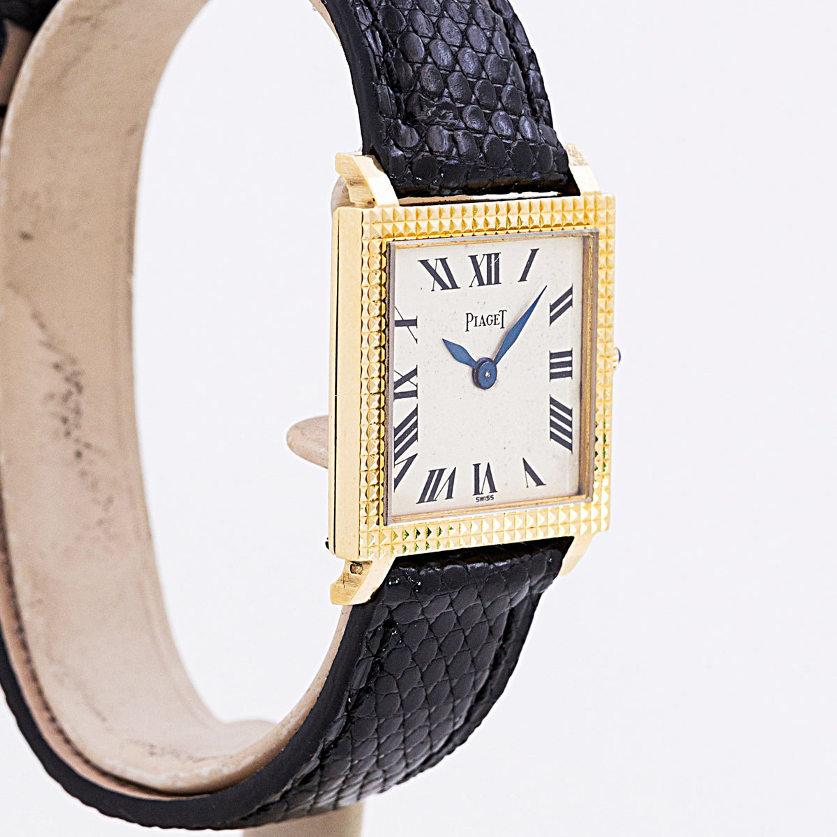 Piaget square yellow gold Ref. 9357, clous de Paris guilloché bezel and white Roman numeral dial