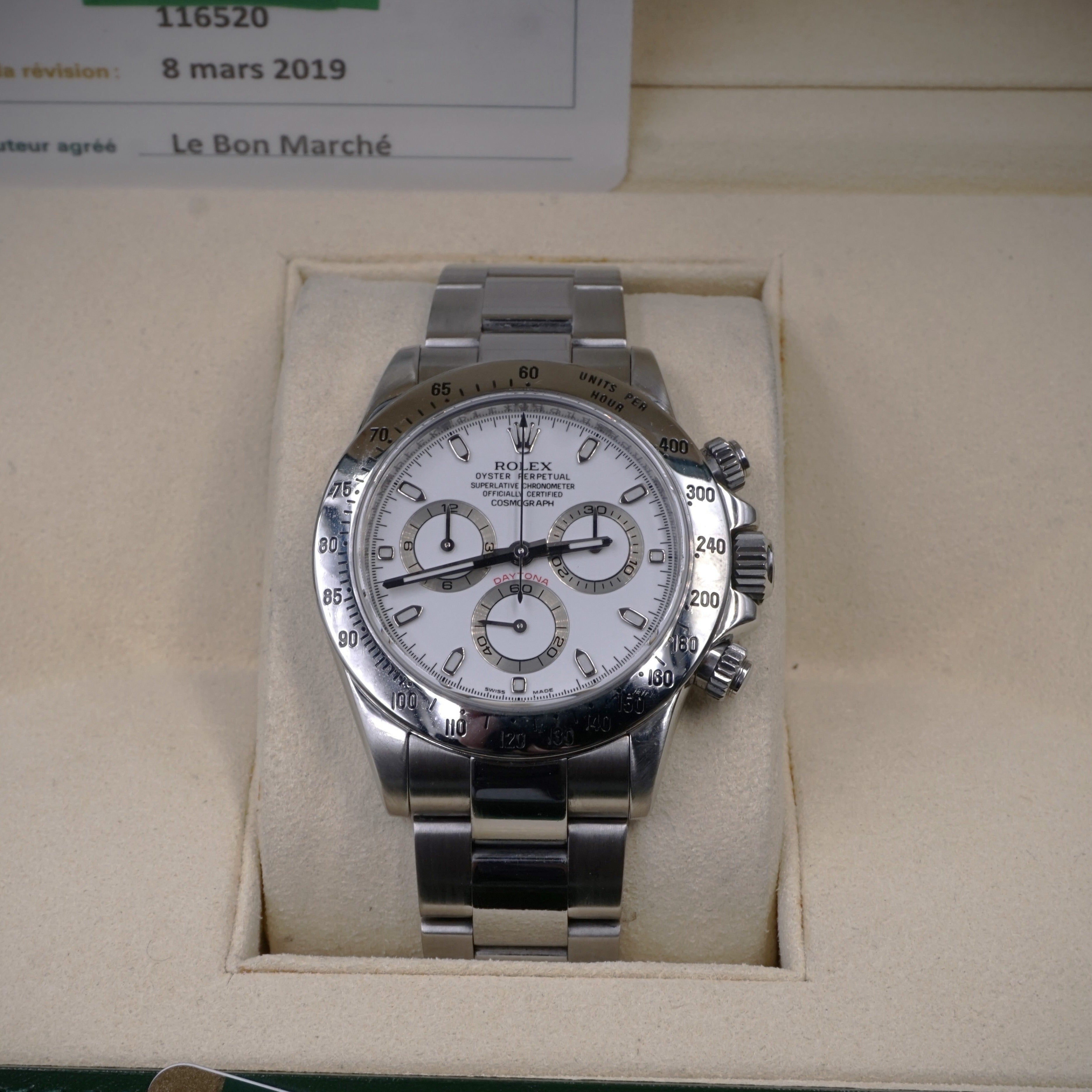 Rolex Cosmograph Daytona white dial vintage chronograph with automatic movement in steel on steel Oyster strap Ref 116520 from 2009 face view in the box