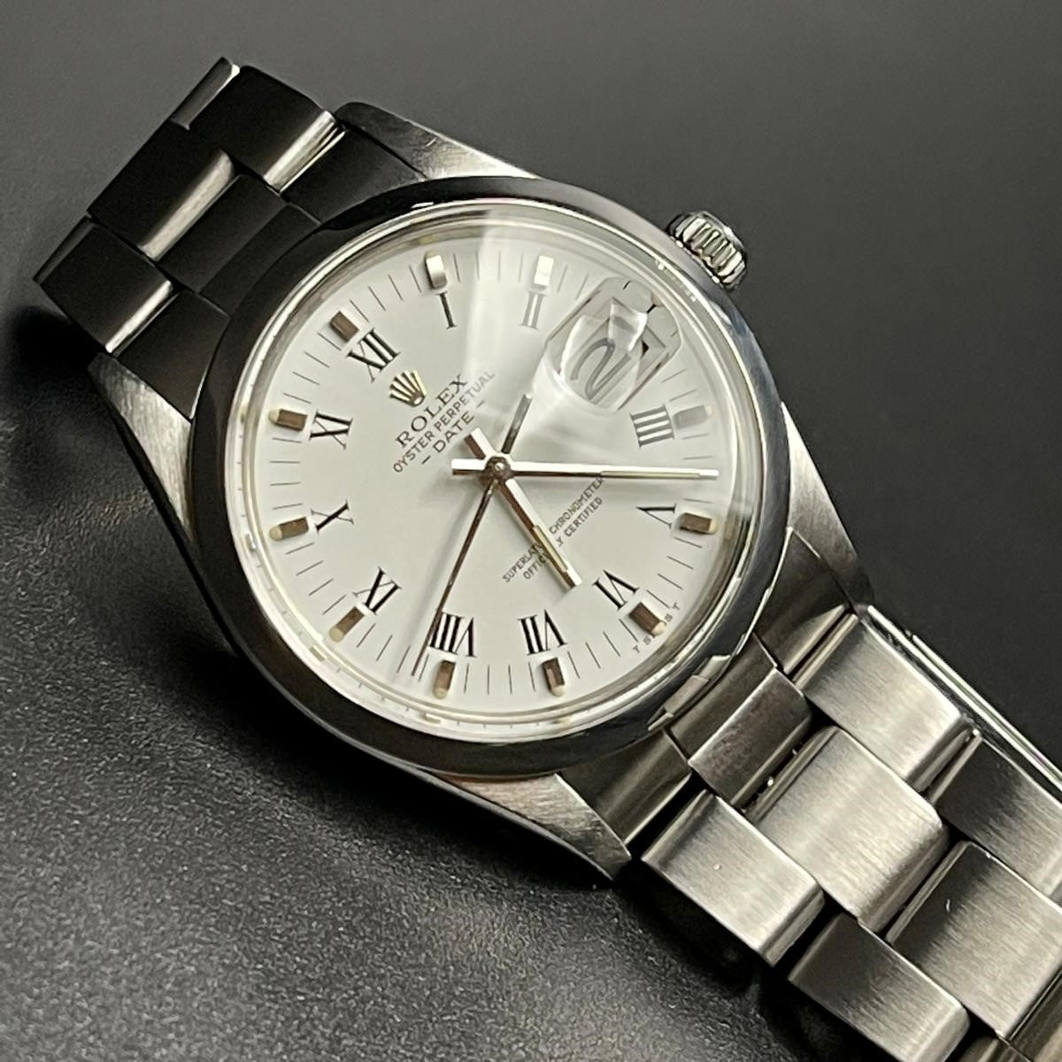 Rolex Oyster Perpetual Date reference 1500, steel, smooth bezel, white Roman numerals dial, ca. 1965