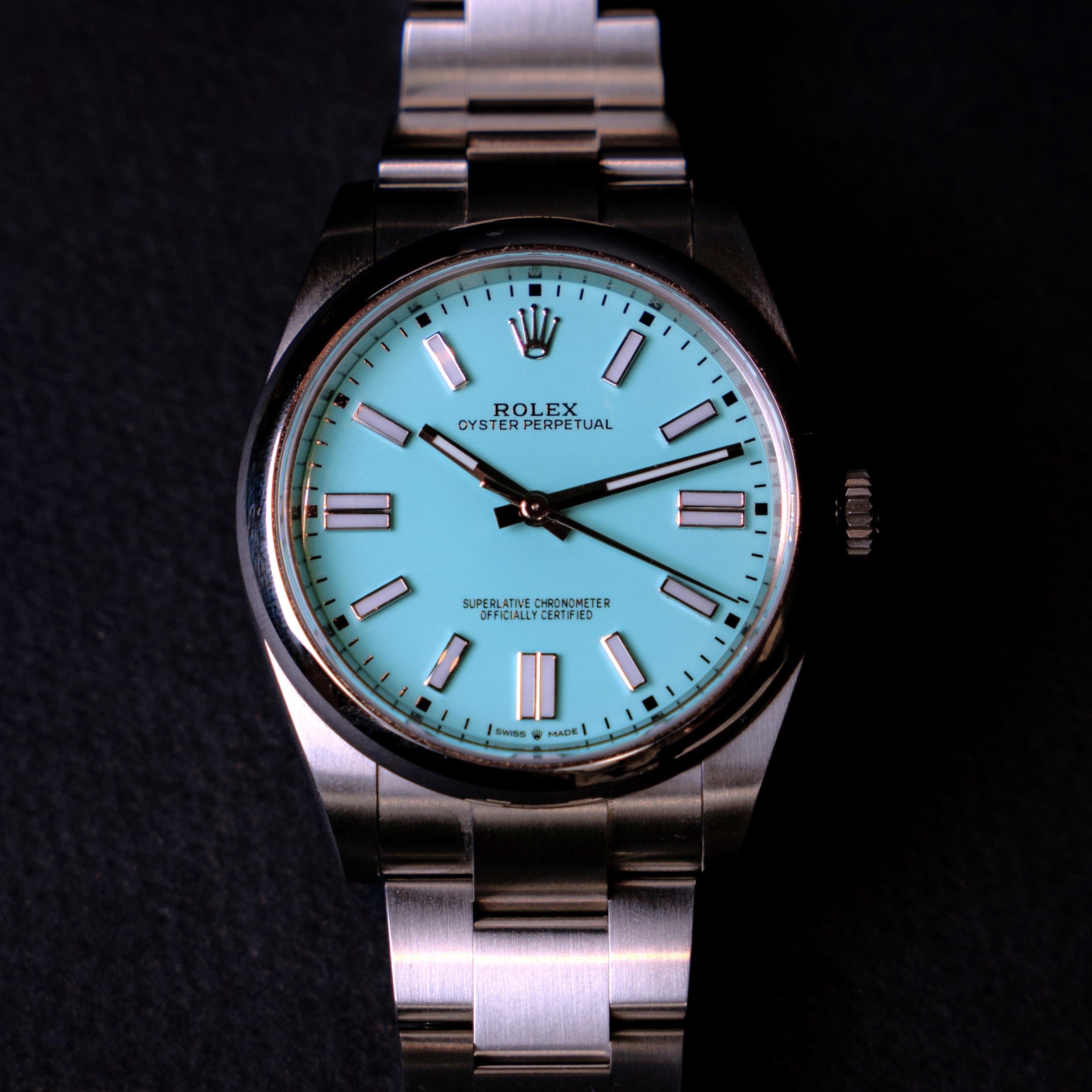 Rolex Oyster Perpetual watch from 2021 with the highly sought after "Tiffany" blue dial in 41 mm steel ref 124300 on its original Oyster bracelet face view.