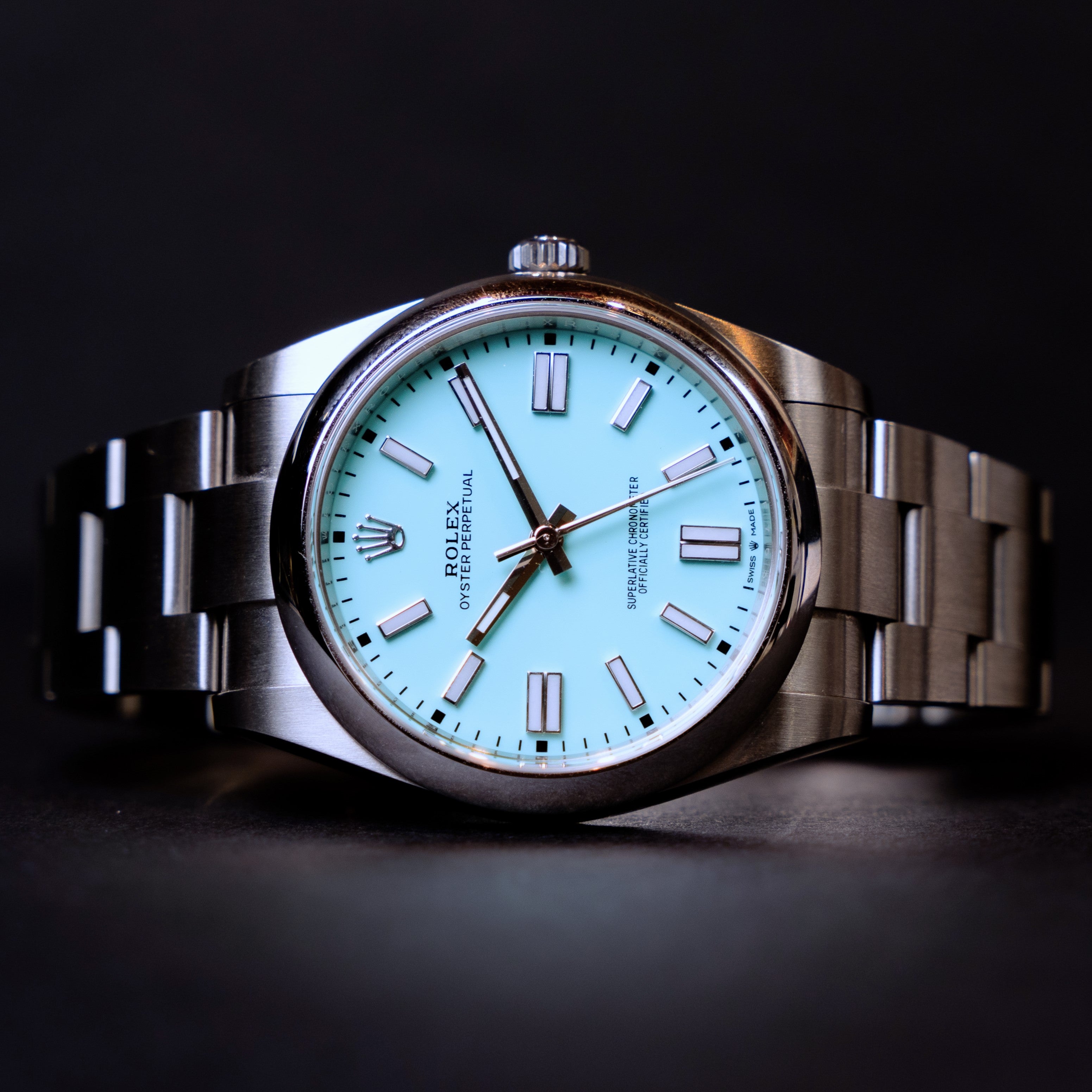 Rolex Oyster Perpetual watch from 2021 with the highly sought after "Tiffany" blue dial in 41 mm steel ref 124300 on its original Oyster bracelet distant face view.