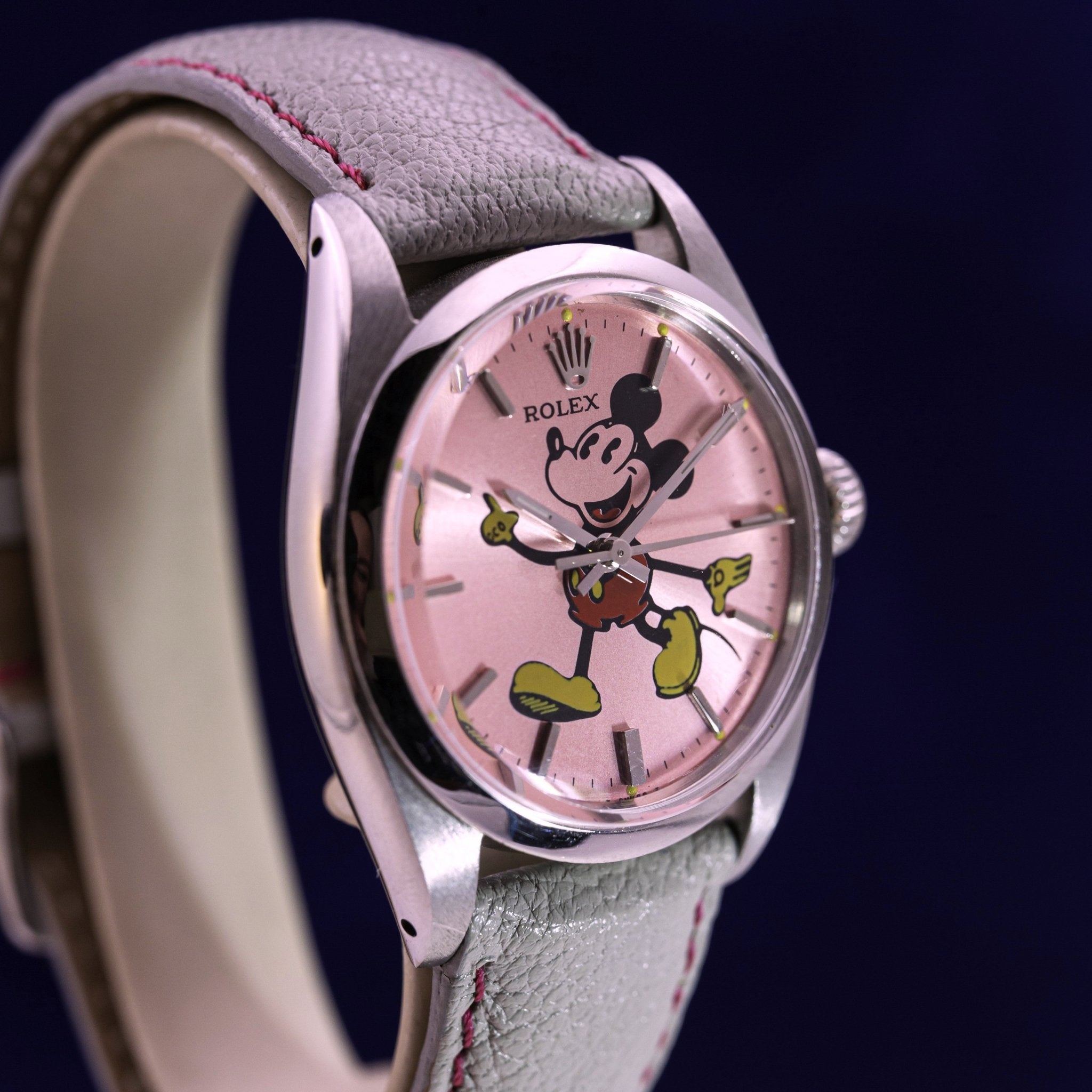 Rolex Oyster Precision Ref. 6426 with custom Mickey dial on pink background. Contre - Temps Paris